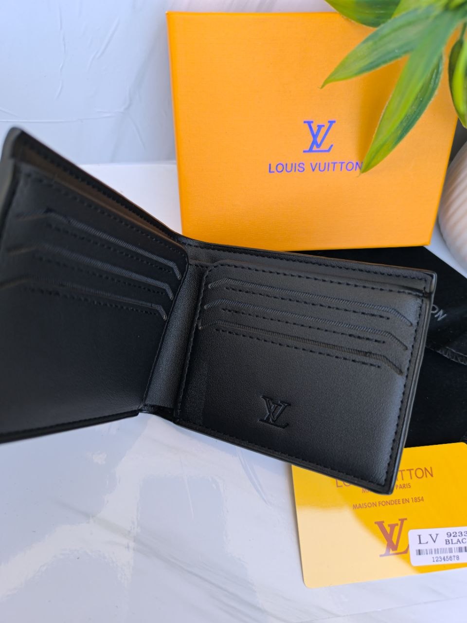 Louis Vuitton Monogram Embossed Men's Bifold Wallet - Black